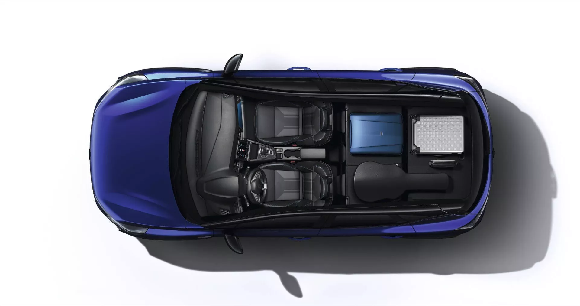 Widok z lotu ptaka Renault Captur II facelifting 2024 podkreślający żywy niebieski kolor, solidny dach bez szyberdachu, standardowe koła ze stopów lekkich i układ siedzeń w dwóch rzędach